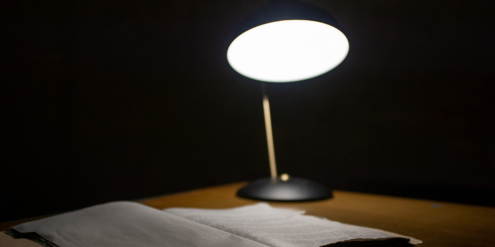 escape room lamp on desk in a dark room