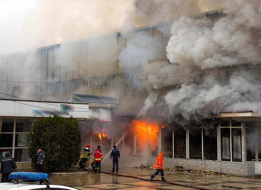 BMS–responders-apply-water-to-burning-office-building